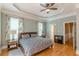 Spacious main bedroom with hardwood floors and tray ceiling at 3044 Dogwood Dr, Atlanta, GA 30354