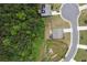 Aerial view of a home with a fenced backyard situated in a neighborhood with lush greenery at 165 Brookstone E Park, Acworth, GA 30101