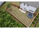 Aerial view of the fenced backyard featuring a well-kept lawn and a trampoline at 165 Brookstone E Park, Acworth, GA 30101