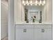 Bright bathroom featuring a double vanity with white cabinets and countertop, complemented by sleek, dark hardware at 165 Brookstone E Park, Acworth, GA 30101