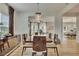 Elegant dining room with a modern chandelier and access to the cozy living room and kitchen at 165 Brookstone E Park, Acworth, GA 30101