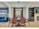 Sophisticated dining room adjacent to a blue living room and a fireplace accent wall at 165 Brookstone E Park, Acworth, GA 30101