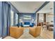 Cozy living room featuring a blue sofa, leather chairs, and bright natural light at 165 Brookstone E Park, Acworth, GA 30101