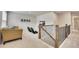 Upstairs loft area with comfortable seating, providing additional living space and staircase access to lower level at 165 Brookstone E Park, Acworth, GA 30101