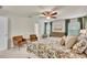 Calm main bedroom featuring a king-sized bed, sitting area, and windows offering a view at 165 Brookstone E Park, Acworth, GA 30101