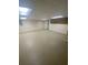 Large unfinished basement featuring neutral paint, concrete floor, and multiple lighting fixtures at 1669 Azalea Dr, Lawrenceville, GA 30043
