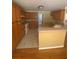 Well-equipped kitchen with wooden cabinetry, tile flooring, and a breakfast bar overlooking the dining area at 1669 Azalea Dr, Lawrenceville, GA 30043