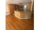 Functional kitchen featuring ample wood cabinets, a breakfast bar, and an open layout connected to the living space at 1669 Azalea Dr, Lawrenceville, GA 30043