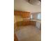 Practical kitchen offering lots of wooden cabinets, efficient appliances, and a breakfast bar for casual dining at 1669 Azalea Dr, Lawrenceville, GA 30043
