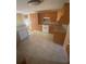 Bright kitchen boasts wood cabinets, tile floors, dishwasher, and gas range at 1669 Azalea Dr, Lawrenceville, GA 30043