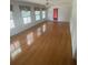 Sun-filled living room with hardwood floors and multiple windows at 1669 Azalea Dr, Lawrenceville, GA 30043