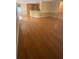 Expansive living space with gleaming hardwood floors and a view of the kitchen, ideal for entertaining at 1669 Azalea Dr, Lawrenceville, GA 30043
