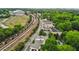 Aerial view showcasing the property's location near train tracks and local businesses at 1672 Dekalb Ne Ave # 2, Atlanta, GA 30307