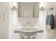 Bathroom with a pedestal sink, modern lighting, and clean lines, offering a minimalist design at 1672 Dekalb Ne Ave # 2, Atlanta, GA 30307