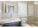 Modern bathroom with a sleek vanity, toilet, glass-enclosed shower, and soft natural light at 1672 Dekalb Ne Ave # 2, Atlanta, GA 30307