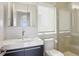 Modern bathroom featuring sleek vanity, toilet and glass-enclosed shower stall at 1672 Dekalb Ne Ave # 2, Atlanta, GA 30307