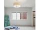 Bright bedroom offers soft carpet, natural light, and neutral tones at 1672 Dekalb Ne Ave # 2, Atlanta, GA 30307