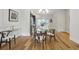 Dining area featuring hardwood floors, modern table and chairs, and view into the kitchen at 1672 Dekalb Ne Ave # 2, Atlanta, GA 30307