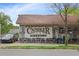 Exterior view of Candler Park Market featuring signage and seating options for a welcoming neighborhood spot at 1672 Dekalb Ne Ave # 2, Atlanta, GA 30307