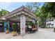 Inviting outdoor patio featuring overhead lighting, decorative pillars, and a shaded seating area for dining at 1672 Dekalb Ne Ave # 2, Atlanta, GA 30307