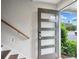Contemporary front door with glass panels and smart lock, opening to a bright entry way at 1672 Dekalb Ne Ave # 2, Atlanta, GA 30307