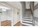 Hallway with hardwood floors, white trim, and an open doorway leading into another living space at 1672 Dekalb Ne Ave # 2, Atlanta, GA 30307