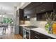 Open-concept kitchen with stainless steel appliances, white countertops, and hardwood floors at 1672 Dekalb Ne Ave # 2, Atlanta, GA 30307