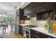 Open kitchen with modern cabinetry, white quartz countertops, stainless steel appliances and hardwood floors at 1672 Dekalb Ne Ave # 2, Atlanta, GA 30307
