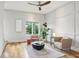 Bright living room features hardwood floors, modern decor, and lots of natural light at 1672 Dekalb Ne Ave # 2, Atlanta, GA 30307