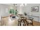 Bright living room with natural light, hardwood flooring, and a chic seating arrangement that is open to the dining area at 1672 Dekalb Ne Ave # 2, Atlanta, GA 30307