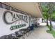 Exterior view of Candler Park Market featuring outdoor seating and classic signage at 1672 Dekalb Ne Ave # 2, Atlanta, GA 30307