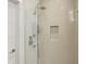 Close-up of a bathroom featuring a glass shower and neutral tiling at 1672 Dekalb Ne Ave # 2, Atlanta, GA 30307