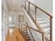 Hardwood staircase featuring metal railing, hardwood floors, and natural light at 1672 Dekalb Ne Ave # 2, Atlanta, GA 30307