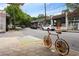 Charming street view features colorful storefronts, street parking, and unique bike rack art at 1672 Dekalb Ne Ave # 2, Atlanta, GA 30307