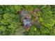 Aerial view showcases the home's setting, surrounded by lush trees, a garden, and a large backyard at 270 Shady Marsh Trl, Roswell, GA 30075