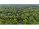 Aerial view of home nestled among lush trees in a densely wooded neighborhood at 270 Shady Marsh Trl, Roswell, GA 30075