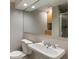 Bright bathroom with pedestal sink, toilet, and large mirror at 270 Shady Marsh Trl, Roswell, GA 30075