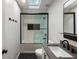 Modern bathroom features stylish subway tile, black hardware, and a skylight offering ample natural light at 270 Shady Marsh Trl, Roswell, GA 30075
