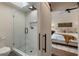 Stylish bathroom showcasing a glass-enclosed shower with white tile, a modern barn door, and a seamless design at 270 Shady Marsh Trl, Roswell, GA 30075