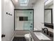 Modern bathroom featuring subway tile, black fixtures, and a sleek, updated design at 270 Shady Marsh Trl, Roswell, GA 30075