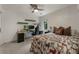 Comfortable bedroom featuring a desk setup and a ceiling fan at 270 Shady Marsh Trl, Roswell, GA 30075