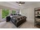 Comfortable bedroom with large windows and a modern ceiling fan at 270 Shady Marsh Trl, Roswell, GA 30075