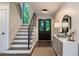 Bright entryway featuring a staircase, black double doors and a stylish console table at 270 Shady Marsh Trl, Roswell, GA 30075