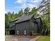 Modern two-story home with dark siding, well-manicured landscaping and multiple decks at 270 Shady Marsh Trl, Roswell, GA 30075
