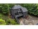 Exterior of home features a deck, lush landscaping, and driveway with basketball hoop at 270 Shady Marsh Trl, Roswell, GA 30075