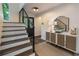 Welcoming entryway with modern lighting and a beautifully decorated console table with accent mirror at 270 Shady Marsh Trl, Roswell, GA 30075