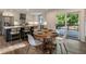 Bright kitchen and dining area with stainless steel appliances, island seating and deck access at 270 Shady Marsh Trl, Roswell, GA 30075