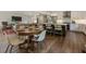 Open concept kitchen with island, white cabinets, stainless appliances, and an adjacent dining area creates an inviting space at 270 Shady Marsh Trl, Roswell, GA 30075
