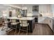 Modern kitchen boasts stainless steel appliances, white cabinets, and a stylish island with seating, perfect for entertaining guests at 270 Shady Marsh Trl, Roswell, GA 30075