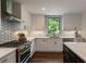 Well-lit kitchen showcasing stainless steel appliances, quartz countertops, and ample cabinet space at 270 Shady Marsh Trl, Roswell, GA 30075